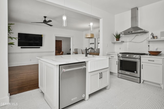 3100 Wheeling Ave, El Paso, TX 79930 - kitchen with island range hood, stainless steel appliances, light stone countertops, open shelves, and pendant lighting