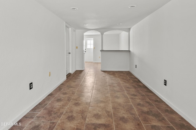 3100 Wheeling Ave, El Paso, TX 79930 - tiled spare room with arched walkways, baseboards, and recessed lighting