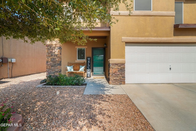 2216 Azure Point Ave, El Paso, TX 79938 - view of front of property with stone siding, stucco siding, driveway, and an attached garage