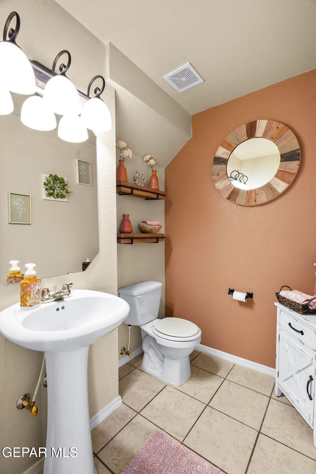 2216 Azure Point Ave, El Paso, TX 79938 - half bath with toilet, baseboards, tile patterned floors, and a sink