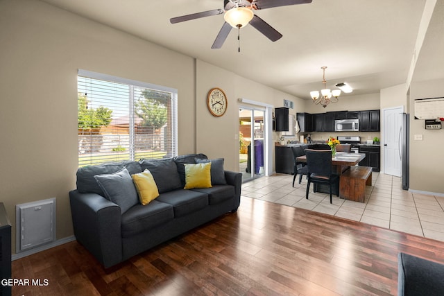 2216 Azure Point Ave, El Paso, TX 79938 - living area with a chandelier, plenty of natural light, a ceiling fan, and light wood-type flooring