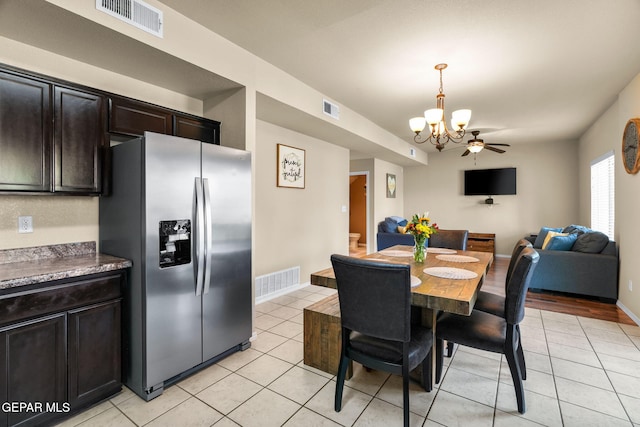 2216 Azure Point Ave, El Paso, TX 79938 - dining space with a chandelier, light tile patterned floors, and baseboards