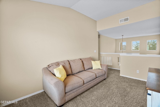 2216 Azure Point Ave, El Paso, TX 79938 - carpeted living room with baseboards and vaulted ceiling
