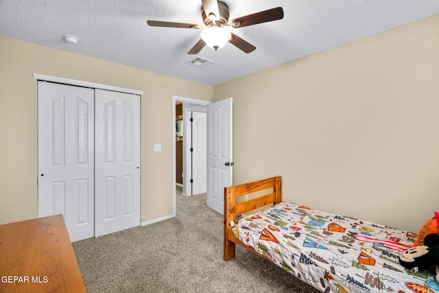 2216 Azure Point Ave, El Paso, TX 79938 - bedroom featuring carpet, a closet, a textured ceiling, and a ceiling fan