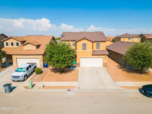 2216 Azure Point Ave, El Paso, TX 79938 - view of front of house with concrete driveway, a residential view, a garage, and stucco siding