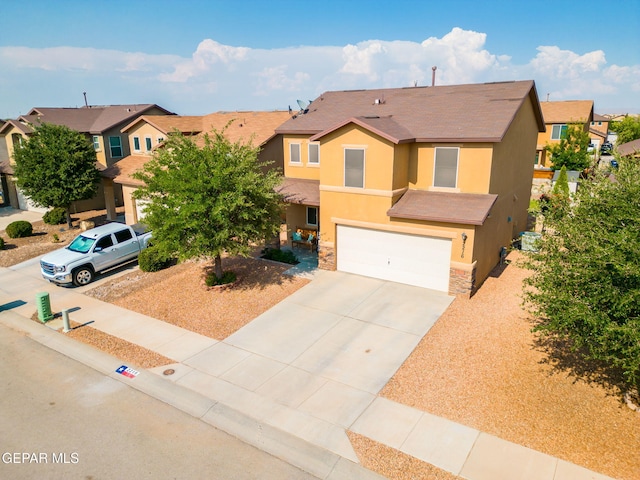 2216 Azure Point Ave, El Paso, TX 79938 - multi unit property with stucco siding, stone siding, a garage, a residential view, and concrete driveway