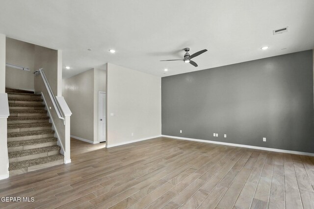 3916 Aspiration, El Paso, TX 79938 - unfurnished living room featuring a ceiling fan, wood finished floors, stairway, baseboards, and recessed lighting