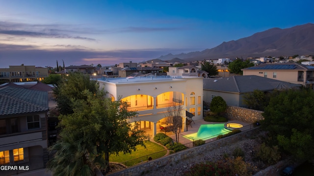 6308 Franklin Vis, El Paso, TX 79912 - back of house featuring a residential view, a fenced backyard, a balcony, a patio area, and a mountain view