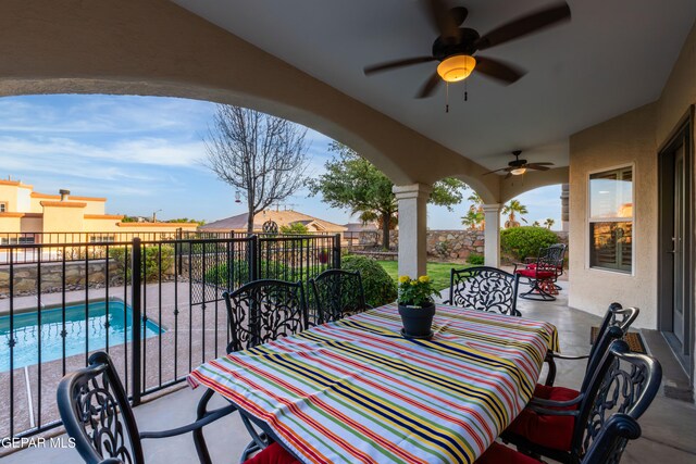 6308 Franklin Vis, El Paso, TX 79912 - view of patio / terrace featuring outdoor dining area, a ceiling fan, and a balcony