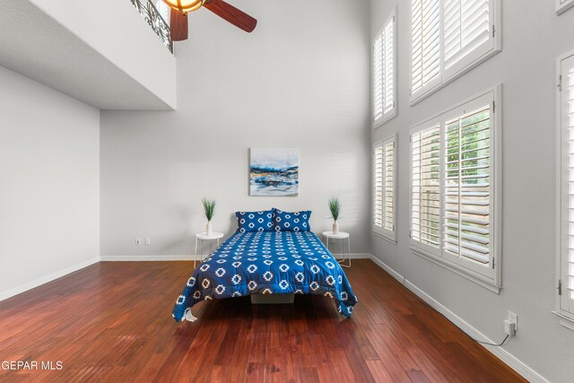 6308 Franklin Vis, El Paso, TX 79912 - bedroom with a towering ceiling, wood finished floors, baseboards, and ceiling fan