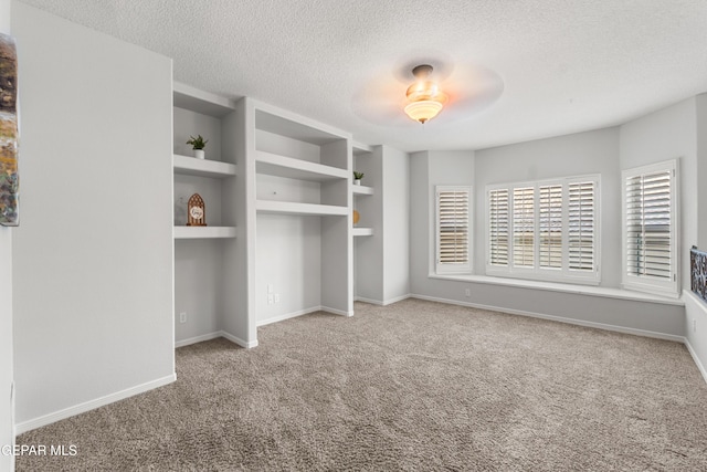 6308 Franklin Vis, El Paso, TX 79912 - unfurnished bedroom featuring carpet, a textured ceiling, and baseboards