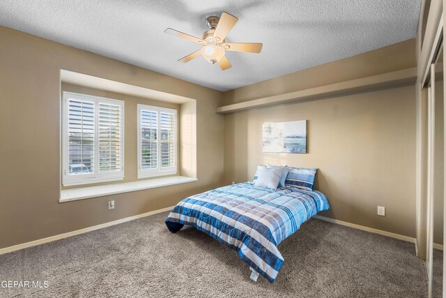 6308 Franklin Vis, El Paso, TX 79912 - carpeted bedroom featuring a textured ceiling, baseboards, and ceiling fan
