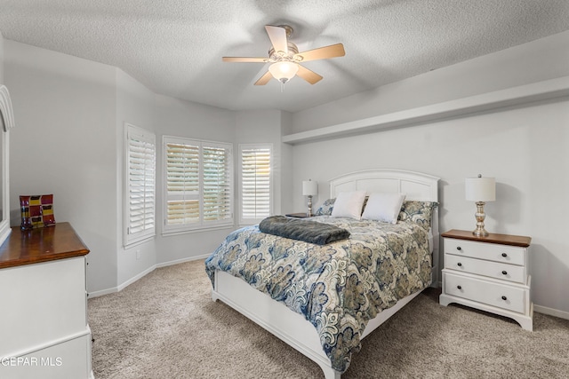 6308 Franklin Vis, El Paso, TX 79912 - bedroom featuring light carpet, a textured ceiling, baseboards, and ceiling fan