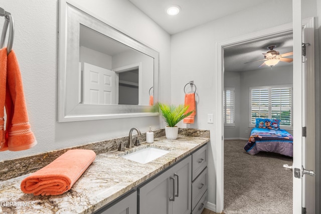6308 Franklin Vis, El Paso, TX 79912 - ensuite bathroom with vanity, baseboards, and ceiling fan