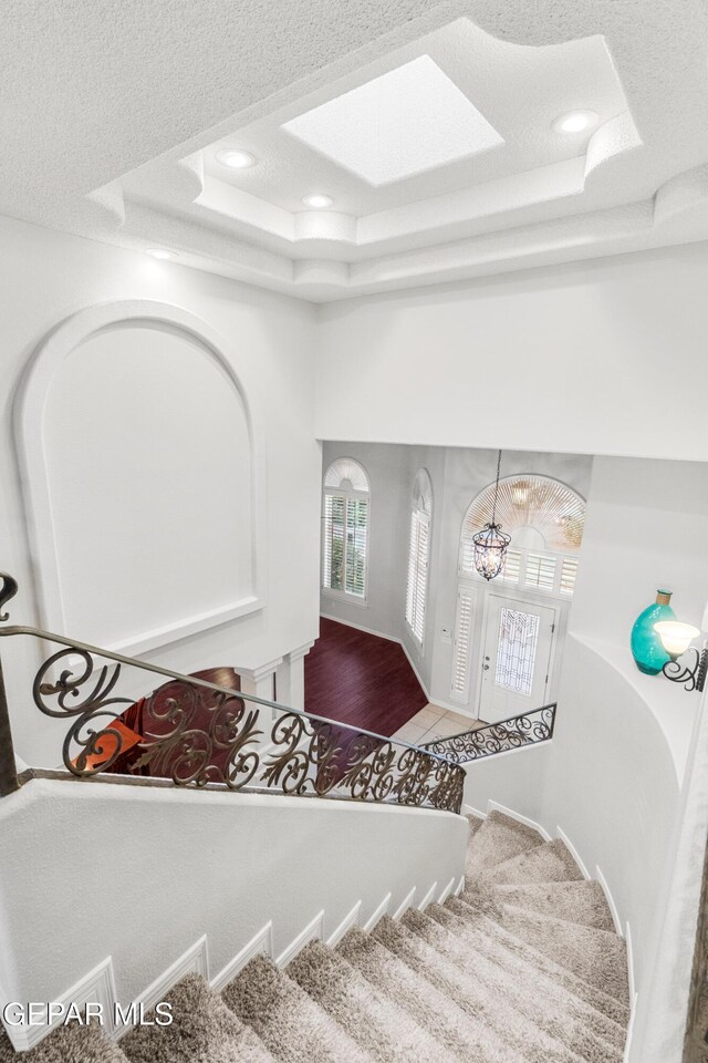 6308 Franklin Vis, El Paso, TX 79912 - stairway with a raised ceiling, recessed lighting, and a towering ceiling