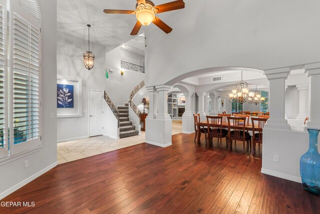 6308 Franklin Vis, El Paso, TX 79912 - entryway featuring decorative columns, stairway, a ceiling fan, arched walkways, and a high ceiling