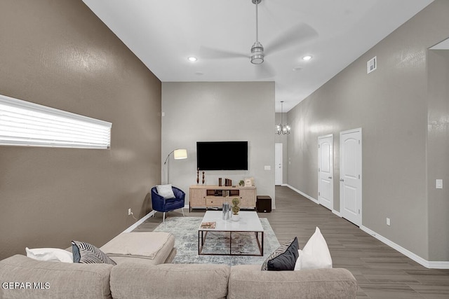 3936 Aspiration, El Paso, TX 79938 - living area with a ceiling fan, wood finished floors, a chandelier, baseboards, and recessed lighting