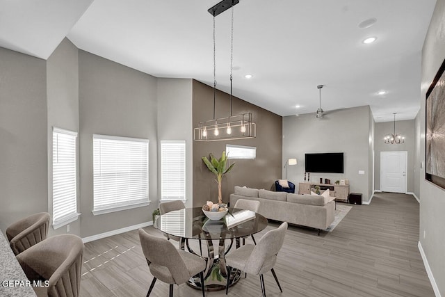 3936 Aspiration, El Paso, TX 79938 - dining space with baseboards, recessed lighting, light wood finished floors, a chandelier, and a towering ceiling