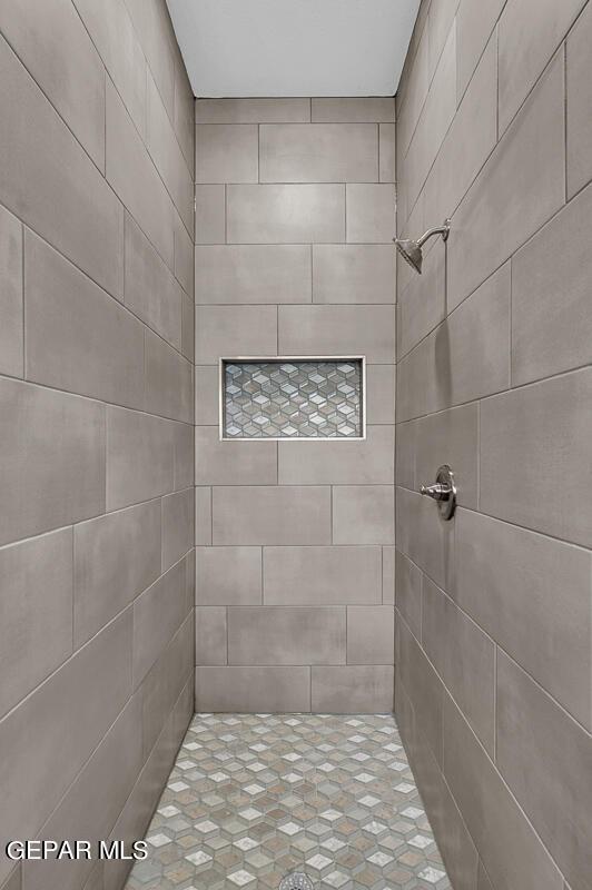 3936 Aspiration, El Paso, TX 79938 - full bathroom with tiled shower