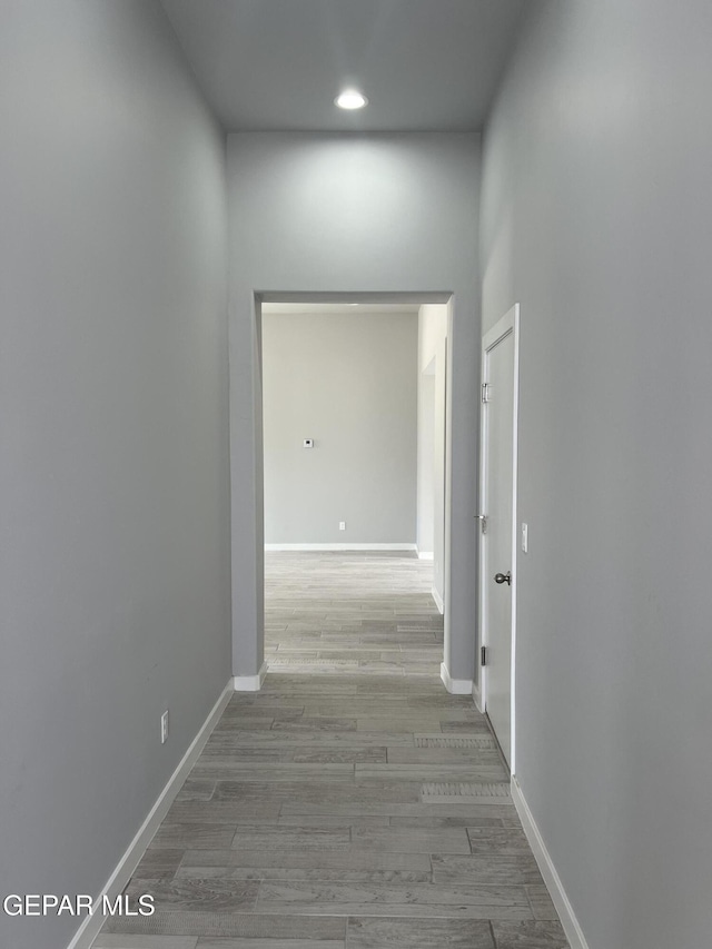 497 Plateau Dr, Socorro, TX 79927 - hall with recessed lighting, wood finished floors, and baseboards