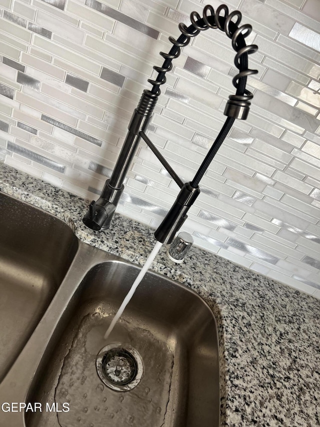 497 Plateau Dr, Socorro, TX 79927 - kitchen view of a sink and stone counters