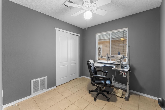 2297 Lisa Sherr St, El Paso, TX 79938 - office with ceiling fan, a textured ceiling, light tile patterned floors, and baseboards