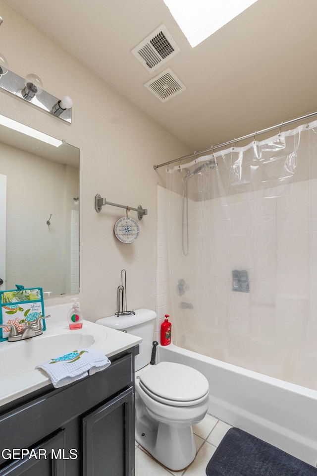 2297 Lisa Sherr St, El Paso, TX 79938 - bathroom with toilet, tile patterned flooring, vanity, and shower / bathtub combination with curtain