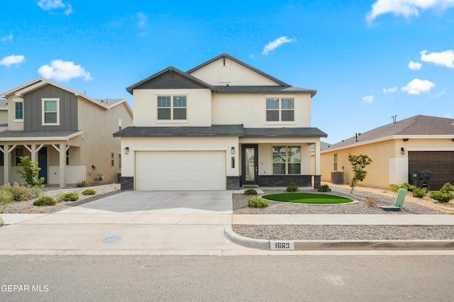 1669 Sam Dominguez, El Paso, TX 79928 - view of front of property featuring stucco siding, concrete driveway, a garage, stone siding, and a porch