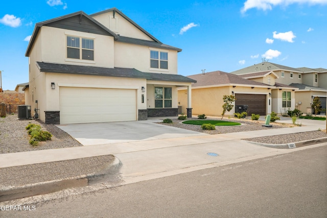 1669 Sam Dominguez, El Paso, TX 79928 - view of front of home featuring cooling unit, stucco siding, stone siding, and concrete driveway