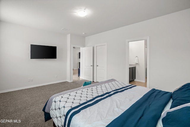 1669 Sam Dominguez, El Paso, TX 79928 - bedroom featuring light carpet, baseboards, and ensuite bathroom