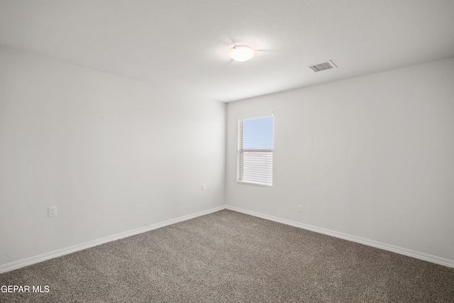 1669 Sam Dominguez, El Paso, TX 79928 - empty room with dark colored carpet and baseboards