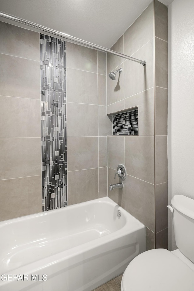 1669 Sam Dominguez, El Paso, TX 79928 - bathroom featuring toilet and washtub / shower combination
