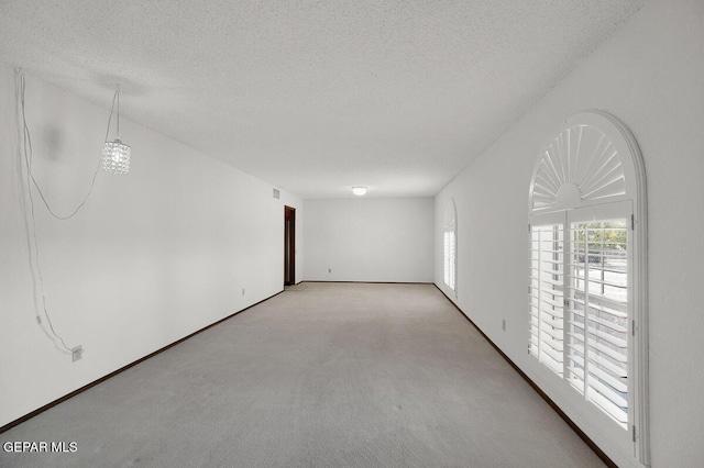 1126 Loma Verde Dr, El Paso, TX 79936 - carpeted spare room featuring a textured ceiling