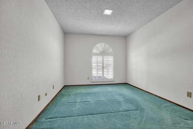 1126 Loma Verde Dr, El Paso, TX 79936 - spare room with a textured wall, a textured ceiling, carpet flooring, and baseboards