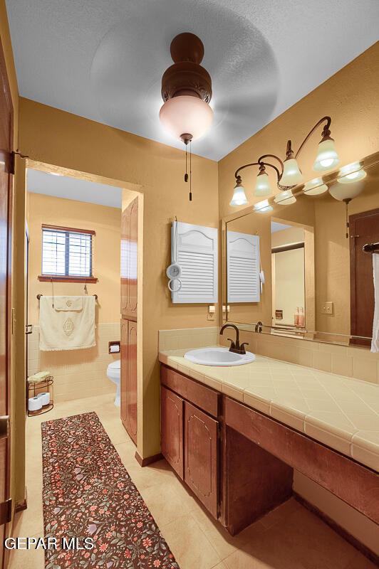 1126 Loma Verde Dr, El Paso, TX 79936 - bathroom featuring tile patterned flooring, vanity, and toilet