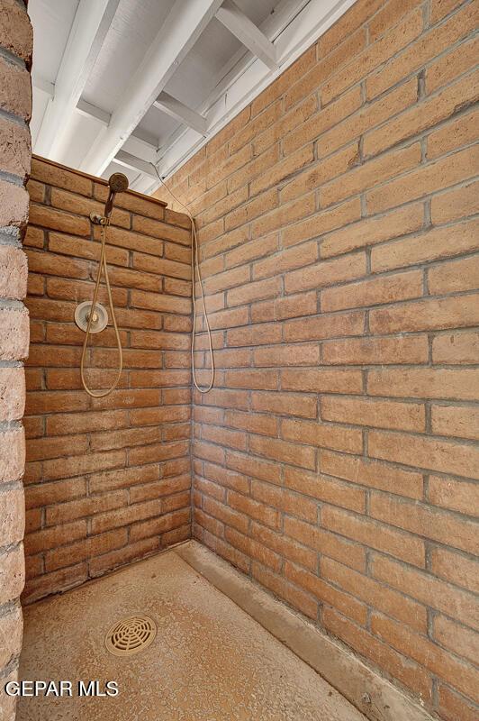 1126 Loma Verde Dr, El Paso, TX 79936 - basement featuring brick wall