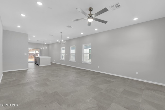 13813 Summer Hail Ave, El Paso, TX 79928 - unfurnished living room featuring a chandelier, ceiling fan, recessed lighting, and baseboards