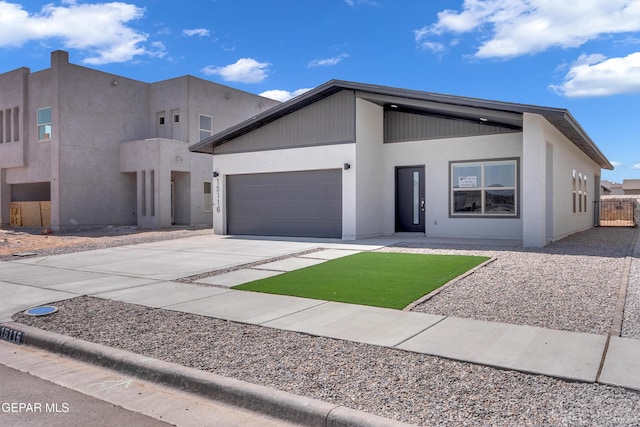 13865 Summer Wave Ave, Horizon City, TX 79928 - view of front of property featuring an attached garage, driveway, and stucco siding