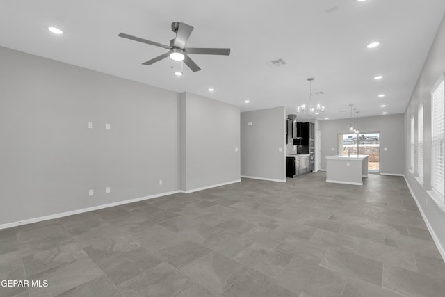 13865 Summer Wave Ave, Horizon City, TX 79928 - unfurnished living room with a chandelier, a ceiling fan, recessed lighting, baseboards, and a sink