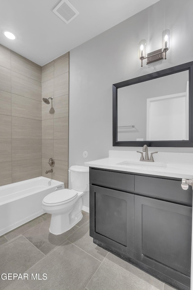 13865 Summer Wave Ave, Horizon City, TX 79928 - full bath with vanity, toilet, shower / bathtub combination, and tile patterned floors
