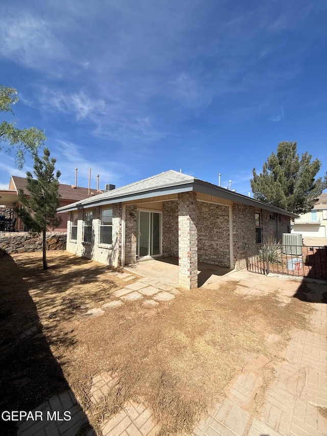 6840 Ridge Top Dr, El Paso, TX 79904 - back of property featuring a patio area