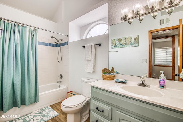 4521 Loma De Plata Dr, El Paso, TX 79934 - full bath featuring vanity, wood finished floors, shower / bath combo, and toilet