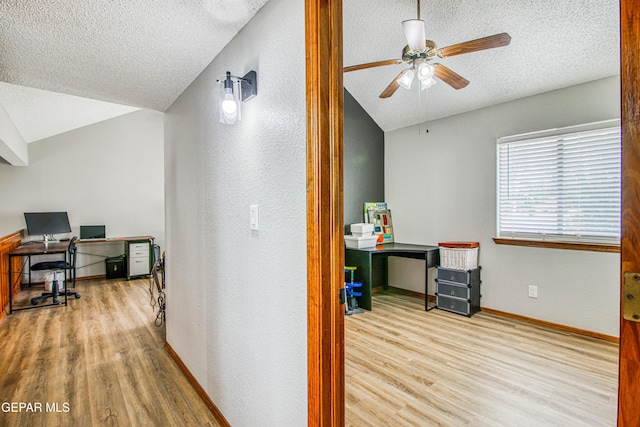 4521 Loma De Plata Dr, El Paso, TX 79934 - home office with vaulted ceiling, wood finished floors, a textured ceiling, a textured wall, and a ceiling fan