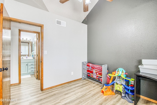 4521 Loma De Plata Dr, El Paso, TX 79934 - playroom with wood finished floors, vaulted ceiling, ceiling fan, and baseboards