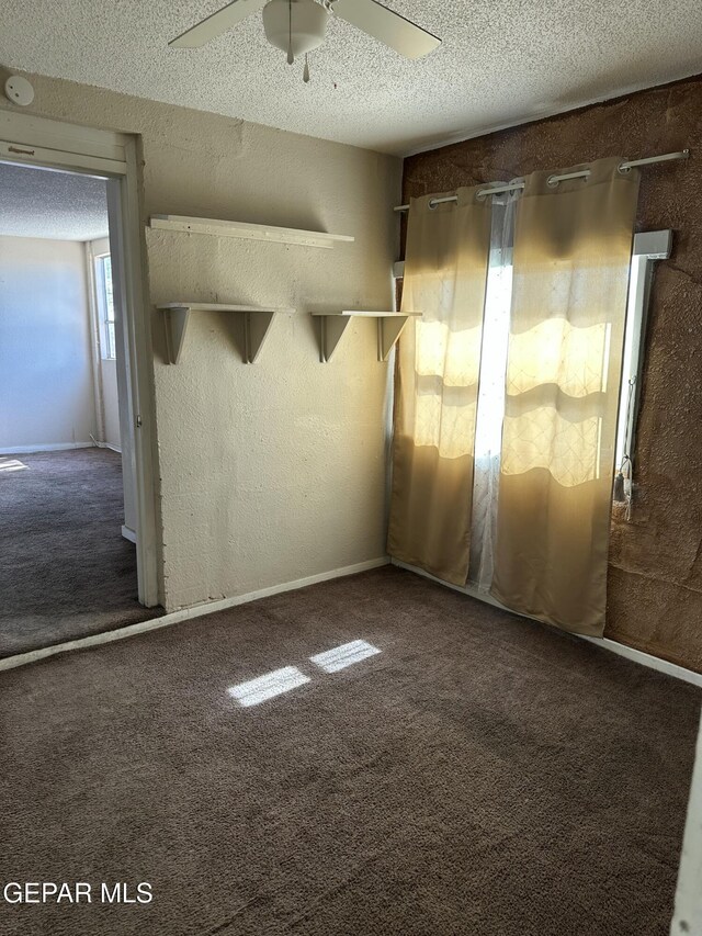 7800 Monterrey Dr, El Paso, TX 79915 - spare room with carpet flooring, a textured ceiling, ceiling fan, and a smoke detector