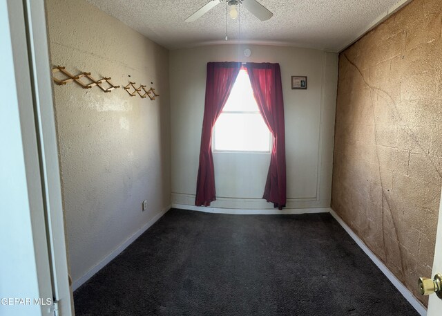 7800 Monterrey Dr, El Paso, TX 79915 - spare room with ceiling fan, a textured ceiling, dark colored carpet, and baseboards