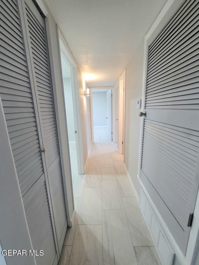 2916 Beachcomber, El Paso, TX 79936 - hall featuring light marble finish flooring and baseboards