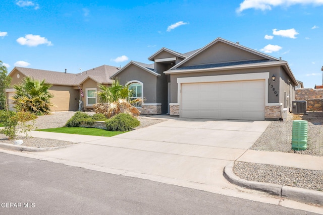 13804 Sky Ranger Ave, Horizon City, TX 79928 - single story home featuring central air condition unit, stucco siding, a garage, driveway, and stone siding