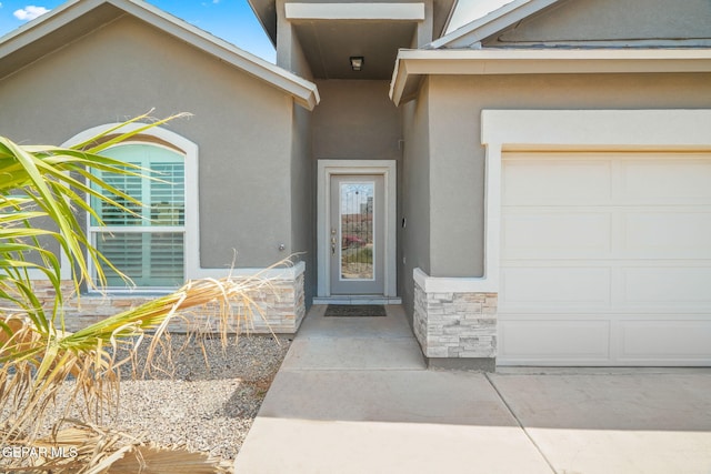 13804 Sky Ranger Ave, Horizon City, TX 79928 - entrance to property featuring stucco siding, stone siding, and a garage