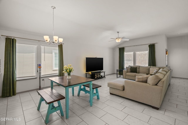 13804 Sky Ranger Ave, Horizon City, TX 79928 - living area featuring a chandelier, ceiling fan, vaulted ceiling, and light tile patterned flooring
